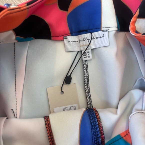 Never Fully Dresses abstract print flare pants with acrylic flower buckle - Picture 3 of 5